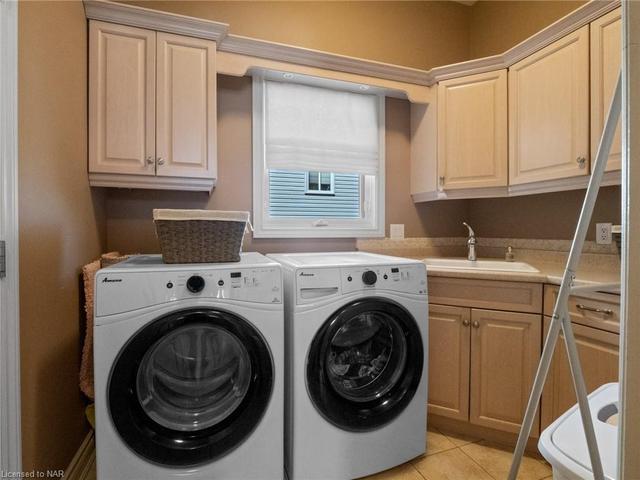 Laundry room with sink, window and plenty of storage - you'll love it! | Image 9