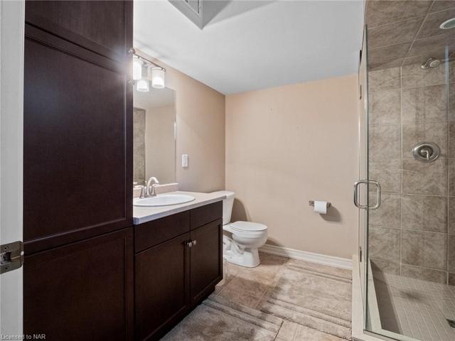 Basement bathroom next to Gym with walk-in shower. | Image 32
