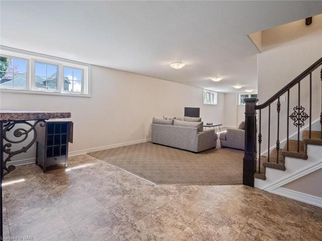 Tiled area leads to Wet Bar and walk-up to basement. | Image 28