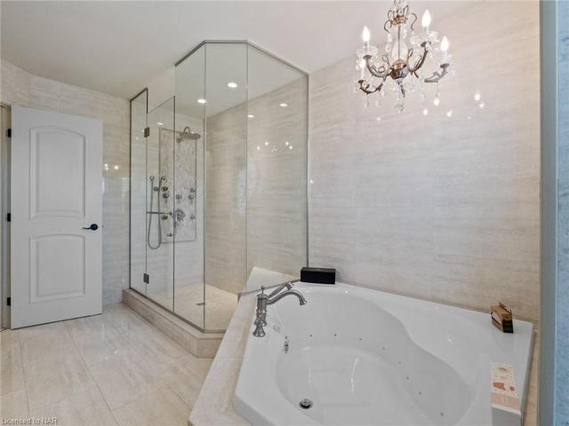 Ensuite #1 - Spa walk-in  tiled shower with body jets and rain shower head. | Image 17