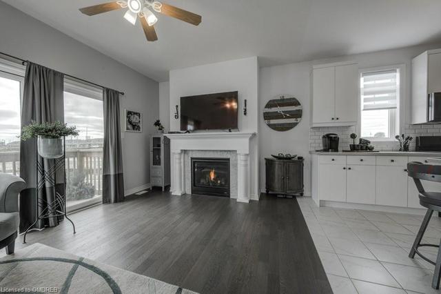 Living Room with Sliding Glass door to Backyard and Gas Fireplace. | Image 14