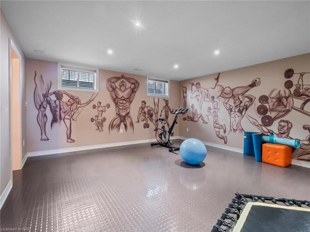 Gym space with mirrored wall. Slip and stain resistant flooring. Easily converted into another room with door, if required. | Image 31