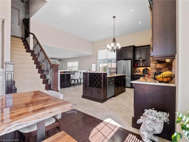 Pass the Dining Room, are the stairs to 2nd floor and the Kitchen. | Image 48