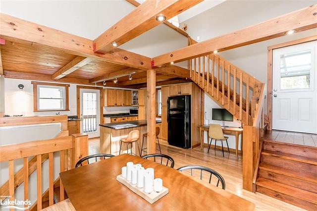 stairs from living room to kitchen/dining area | Image 15