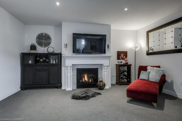 Lower Level Rec Room with so much natural light and gas fireplace. | Image 30