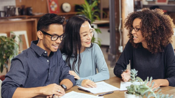 A couple discusses mortgage options with an advisor