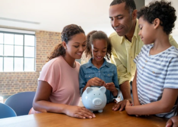 A family saving money in a piggy bank