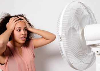 woman in front of fan