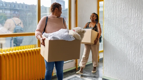 Two young people moving in together