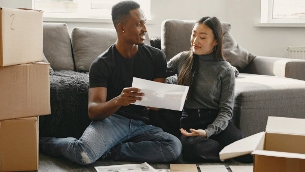 couple talking and looking at documents