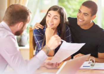 A couple talking to a mortgage broker