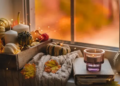 A window sill filled with fall decor.