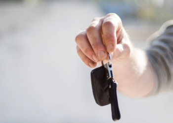 person holding car keys