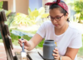 A woman painting a chair