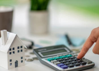 A small home next to a calculator