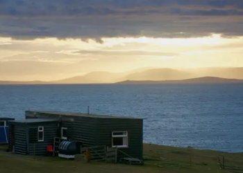 An off-grid home with a a view of the waterfront.