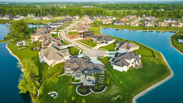 An overhead view of a row of expensive homes