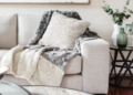 A chunky blanket on a sofa.