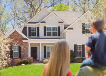 A family looking at a house.