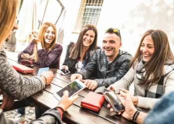 A group of young millennials laughing.