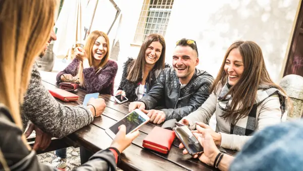 A group of young millennials laughing.