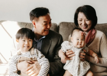 grandparents hugging grand children