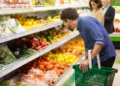 People shopping for groceries in the store.