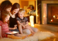 A family spending time with each other near a fireplace.