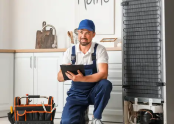 A professional looking at an appliance.