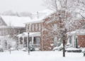 A snowy neighborhood of homes