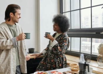 couple chatting drinking coffee at home