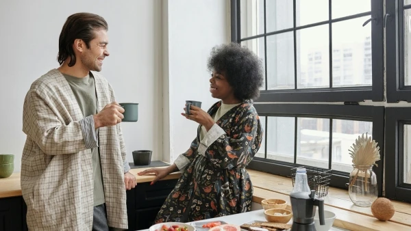 couple chatting drinking coffee at home