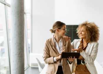 Two working women talking