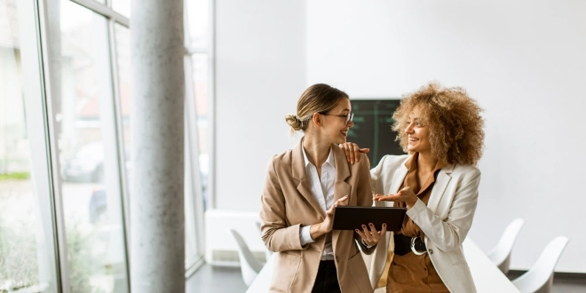 Two working women talking